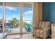 Inviting balcony with chairs and table, offering scenic views and a perfect spot for relaxation at 13427 Blue Heron Beach Dr # 306, Orlando, FL 32821
