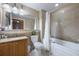 Bathroom featuring a bathtub, shower, granite counters and modern fixtures at 13427 Blue Heron Beach Dr # 306, Orlando, FL 32821