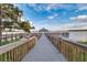 Scenic view of the community dock and gazebo overlooking the lake on a sunny day at 13427 Blue Heron Beach Dr # 306, Orlando, FL 32821
