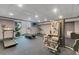 Well-equipped gym with treadmills, elliptical, and weight machines for residents at 13427 Blue Heron Beach Dr # 306, Orlando, FL 32821