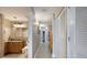 Hallway features access to a full bathroom, bunk room, and bedroom with tile floors and neutral paint at 13427 Blue Heron Beach Dr # 306, Orlando, FL 32821