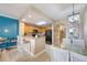 Cozy kitchen with wooden cabinets, black appliances, bar seating, and an open view to the dining area at 13427 Blue Heron Beach Dr # 306, Orlando, FL 32821