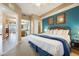 Bright main bedroom featuring a king bed, ensuite bathroom, and walk-in closet at 13427 Blue Heron Beach Dr # 306, Orlando, FL 32821
