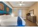 Cozy main bedroom with king bed, dresser with television and outdoor views at 13427 Blue Heron Beach Dr # 306, Orlando, FL 32821