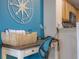 Close up of an office space with a desk, lamp and storage, adjacent to the kitchen at 13427 Blue Heron Beach Dr # 306, Orlando, FL 32821