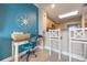Dedicated office space featuring a desk and chair, adjacent to the breakfast bar and kitchen at 13427 Blue Heron Beach Dr # 306, Orlando, FL 32821