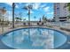 Inviting splash pool with views of the main building and a comfortable atmosphere at 13427 Blue Heron Beach Dr # 306, Orlando, FL 32821