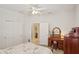 Well-lit bedroom featuring a ceiling fan, neutral walls, and an ensuite bathroom at 1386 Longley Pl, Deland, FL 32724