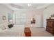Bedroom featuring a ceiling fan, and a view into the living space at 1386 Longley Pl, Deland, FL 32724