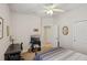Comfortable bedroom featuring carpeted floors, and a ceiling fan for enhanced air circulation at 1386 Longley Pl, Deland, FL 32724