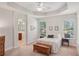 Serene primary bedroom with tray ceilings, and ensuite bathroom at 1386 Longley Pl, Deland, FL 32724