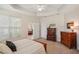 Comfortable bedroom with ceiling fan and access to additional rooms at 1386 Longley Pl, Deland, FL 32724