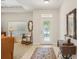 Bright foyer with tile flooring, decorative glass door, and stylish decor at 1386 Longley Pl, Deland, FL 32724