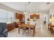 Open concept kitchen featuring stainless steel appliances and a breakfast bar for casual dining at 1386 Longley Pl, Deland, FL 32724