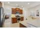 Functional kitchen with stainless steel appliances and convenient access to other living areas at 1386 Longley Pl, Deland, FL 32724