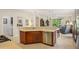 Open kitchen with stone countertops, stainless appliances, and eat in kitchen area at 1386 Longley Pl, Deland, FL 32724