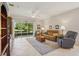 Comfortable living room featuring tile floors and sliding doors to the outdoors at 1386 Longley Pl, Deland, FL 32724