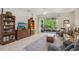 Spacious living room featuring tile flooring, lots of sunlight and access to outdoor spaces at 1386 Longley Pl, Deland, FL 32724