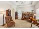 Inviting living room featuring a tray ceiling, neutral walls, and comfortable seating at 1386 Longley Pl, Deland, FL 32724