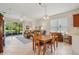 Inviting living space with tiled floors, comfortable seating, and a view of the screened lanai at 1386 Longley Pl, Deland, FL 32724