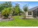 Picture of a spacious backyard with beautiful green grass and landscaping at 140 Rangeline Woods Cv, Longwood, FL 32750