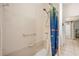 Shower with white tile and fish themed shower curtain at 140 Rangeline Woods Cv, Longwood, FL 32750