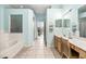 Spacious bathroom featuring double vanity, tiled floor, and a walk-in shower at 140 Rangeline Woods Cv, Longwood, FL 32750