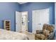 Comfortable bedroom featuring an ensuite bath and closet access at 140 Rangeline Woods Cv, Longwood, FL 32750