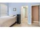 Cozy bedroom featuring a view of a hall and a convenient storage option at 140 Rangeline Woods Cv, Longwood, FL 32750