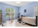 Bright bedroom with window offers a tranquil space for relaxing or working at 140 Rangeline Woods Cv, Longwood, FL 32750