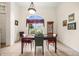 Formal dining room with tile flooring, decorative light fixture, and a large window at 140 Rangeline Woods Cv, Longwood, FL 32750