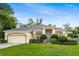 Charming single-story home with well-maintained landscaping, neutral stucco, and a two-car garage in a suburban neighborhood at 140 Rangeline Woods Cv, Longwood, FL 32750
