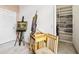 Hallway featuring artwork on an easel and built in shelving with books and decor at 140 Rangeline Woods Cv, Longwood, FL 32750