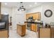 Functional kitchen featuring wooden cabinetry, stainless steel appliances, and granite countertops at 140 Rangeline Woods Cv, Longwood, FL 32750