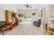 Bright living room with a view of the yard offers space for seating and a workspace at 140 Rangeline Woods Cv, Longwood, FL 32750