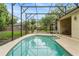 Backyard pool with a screened enclosure at 140 Rangeline Woods Cv, Longwood, FL 32750