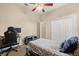 Bedroom featuring a bed, desk, closet, and neutral decor at 14174 Islamorada Dr, Orlando, FL 32837