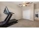 Bedroom featuring a treadmill, closet, and neutral decor at 14174 Islamorada Dr, Orlando, FL 32837