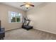 Bedroom featuring a treadmill, window, and neutral decor at 14174 Islamorada Dr, Orlando, FL 32837