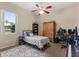 Bedroom featuring a bed, desk, shelving, and a window at 14174 Islamorada Dr, Orlando, FL 32837