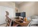 Office area showcasing a modern desk setup and comfortable chair with storage at 14174 Islamorada Dr, Orlando, FL 32837