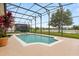 Inviting pool with screened enclosure, surrounded by lush landscaping and scenic views at 14174 Islamorada Dr, Orlando, FL 32837