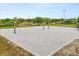 Outdoor beach volleyball court with a pristine sandy surface ready for matches in a tropical setting at 14174 Islamorada Dr, Orlando, FL 32837