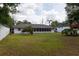 Expansive backyard with mature landscaping and ample green space surrounding the home at 1418 Oregon St, Orlando, FL 32803