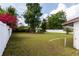 Expansive backyard featuring lush green grass, mature trees, and a privacy fence at 1418 Oregon St, Orlando, FL 32803
