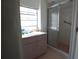 Functional bathroom with shower, vanity and window to outside at 1418 Oregon St, Orlando, FL 32803