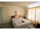 Cozy bedroom with a comfortable bed, soft lighting, and a closet for storage at 1418 Oregon St, Orlando, FL 32803