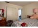 Inviting bedroom featuring a comfortable bed, dresser, closet and serene atmosphere at 1418 Oregon St, Orlando, FL 32803