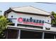A close-up of the Hawkers restaurant exterior, showcasing its signage and Asian-inspired street fare branding at 1418 Oregon St, Orlando, FL 32803