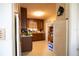 Functional kitchen with wooden cabinets, laminate countertops, and a vintage aesthetic at 1418 Oregon St, Orlando, FL 32803